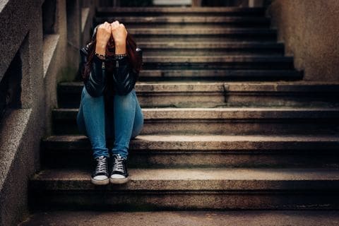 Person Sitting In Stairwell
