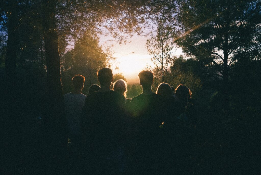 group of people watching the sunset