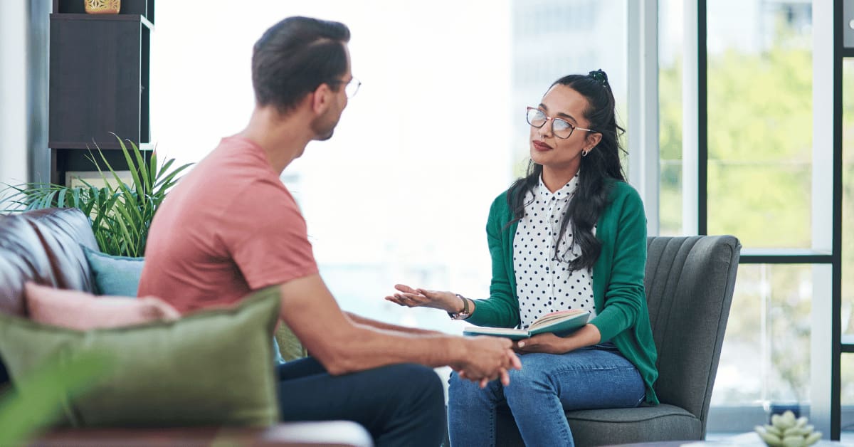 therapist and man talking